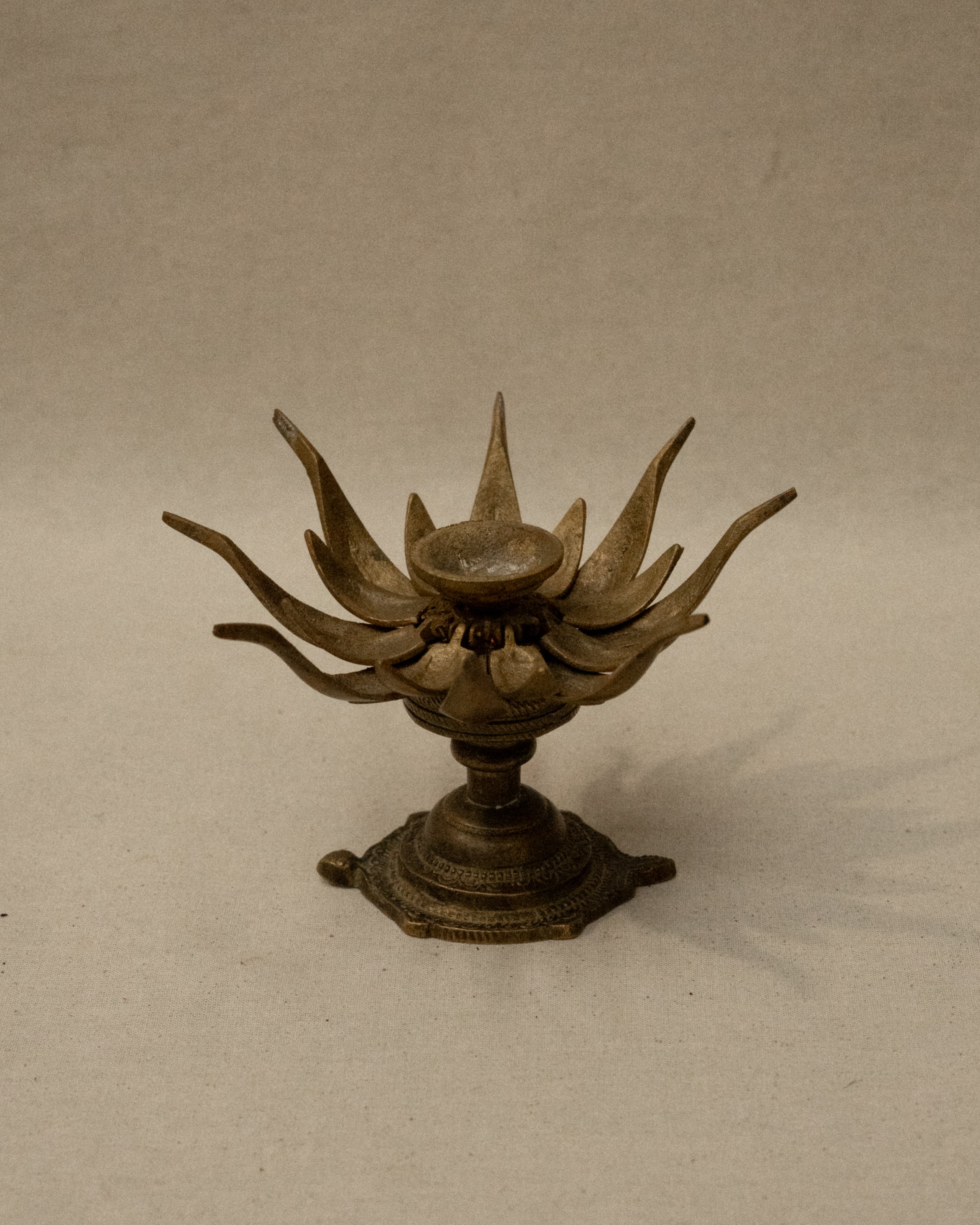 Brass lotus flower on tortoise incense/candle holder