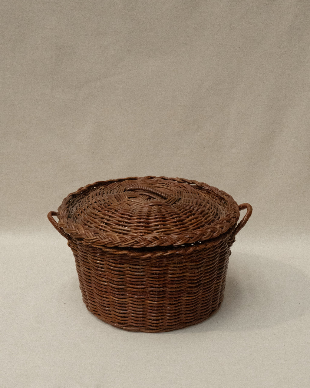 Woven basket with lid and handles