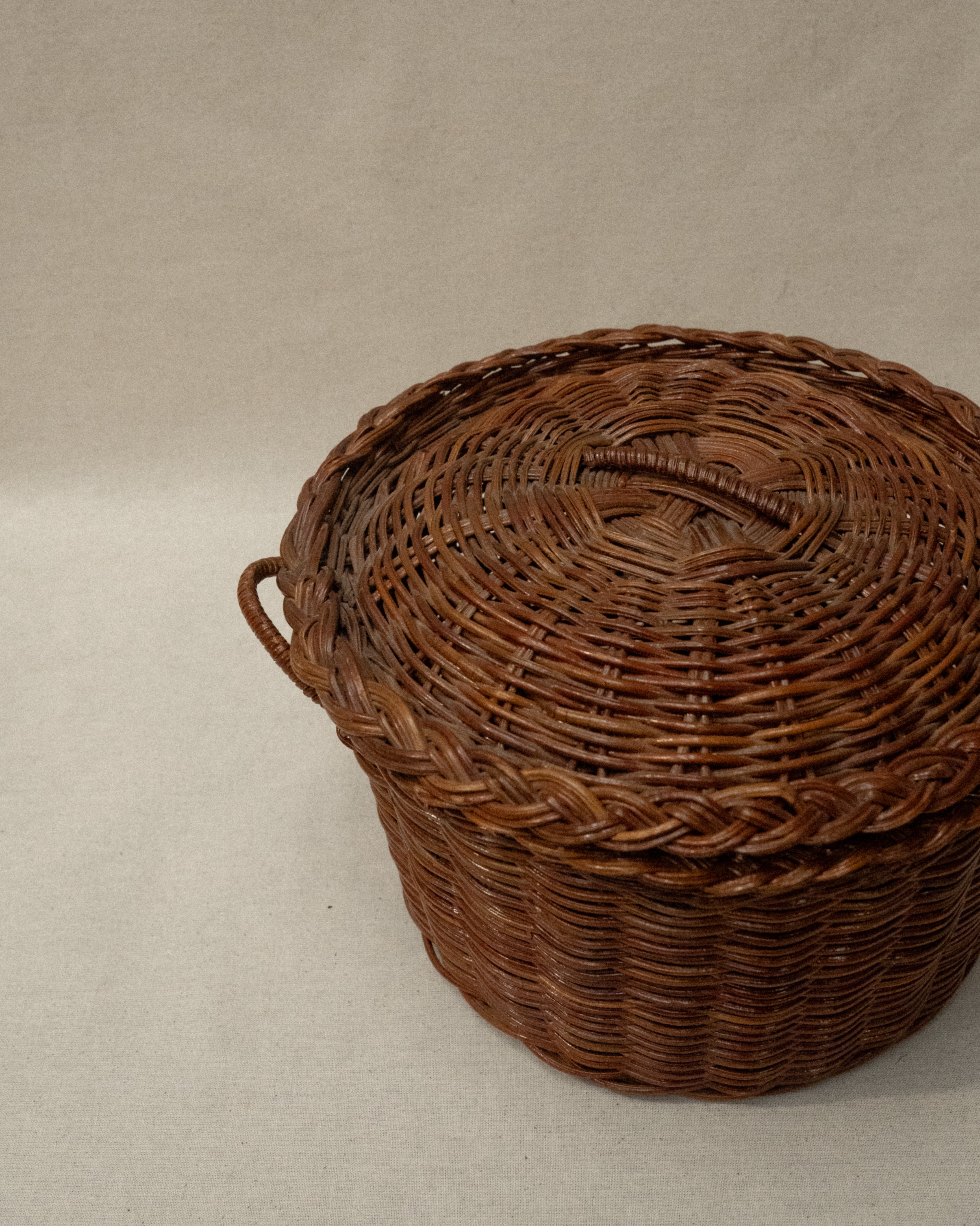 Woven basket with lid and handles