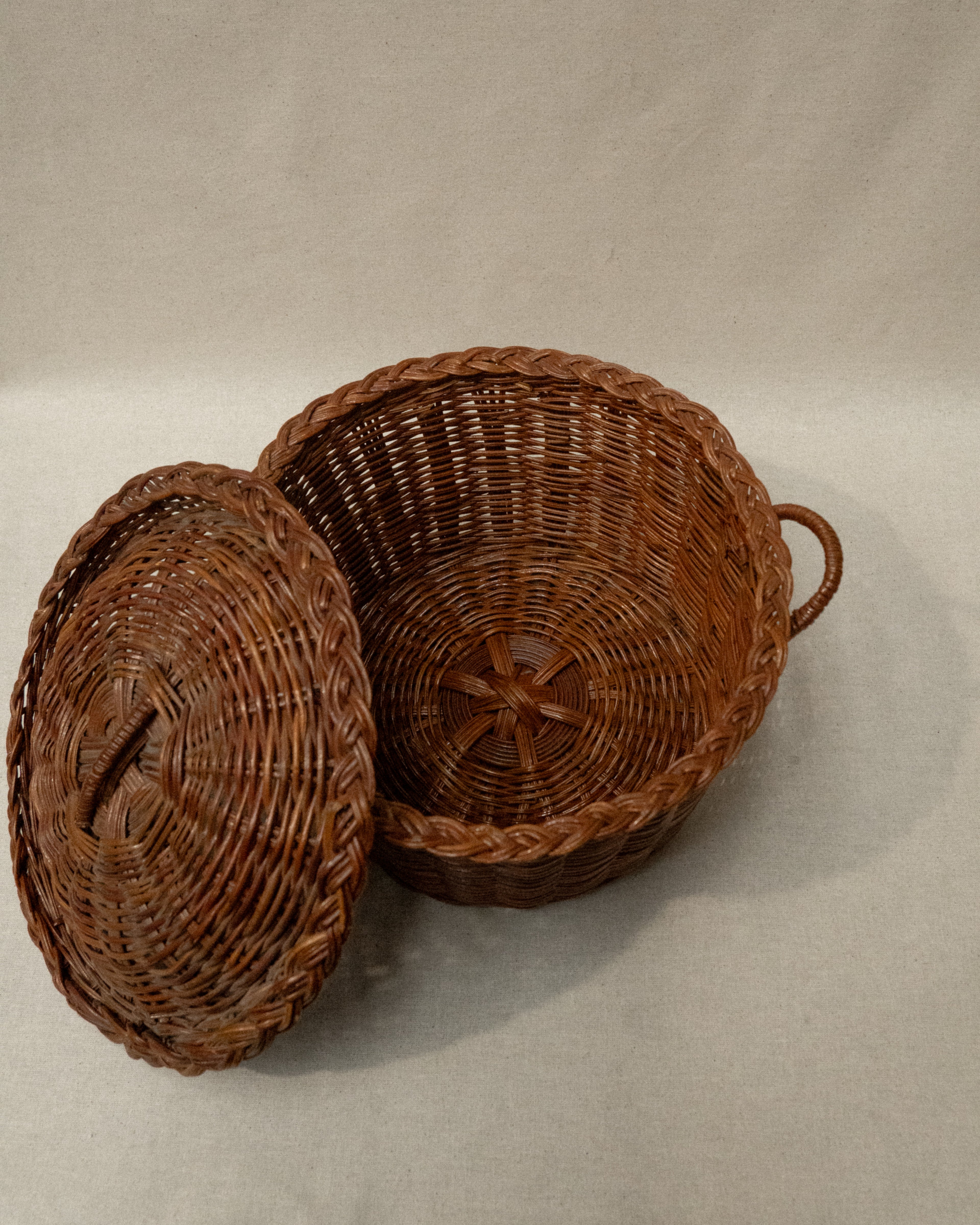 Woven basket with lid and handles