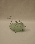 Metal swan with green glass insert