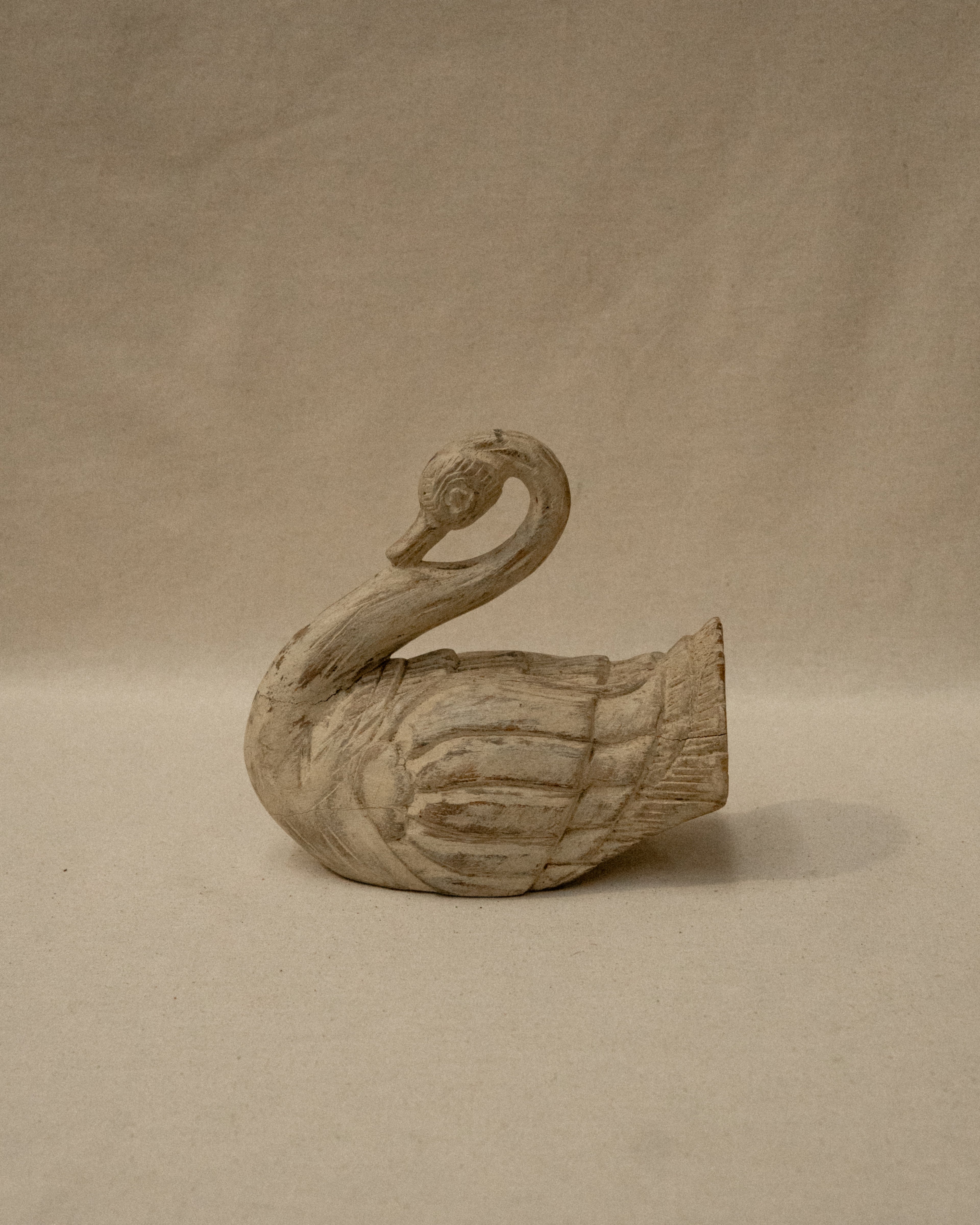 White wooden folk art swan