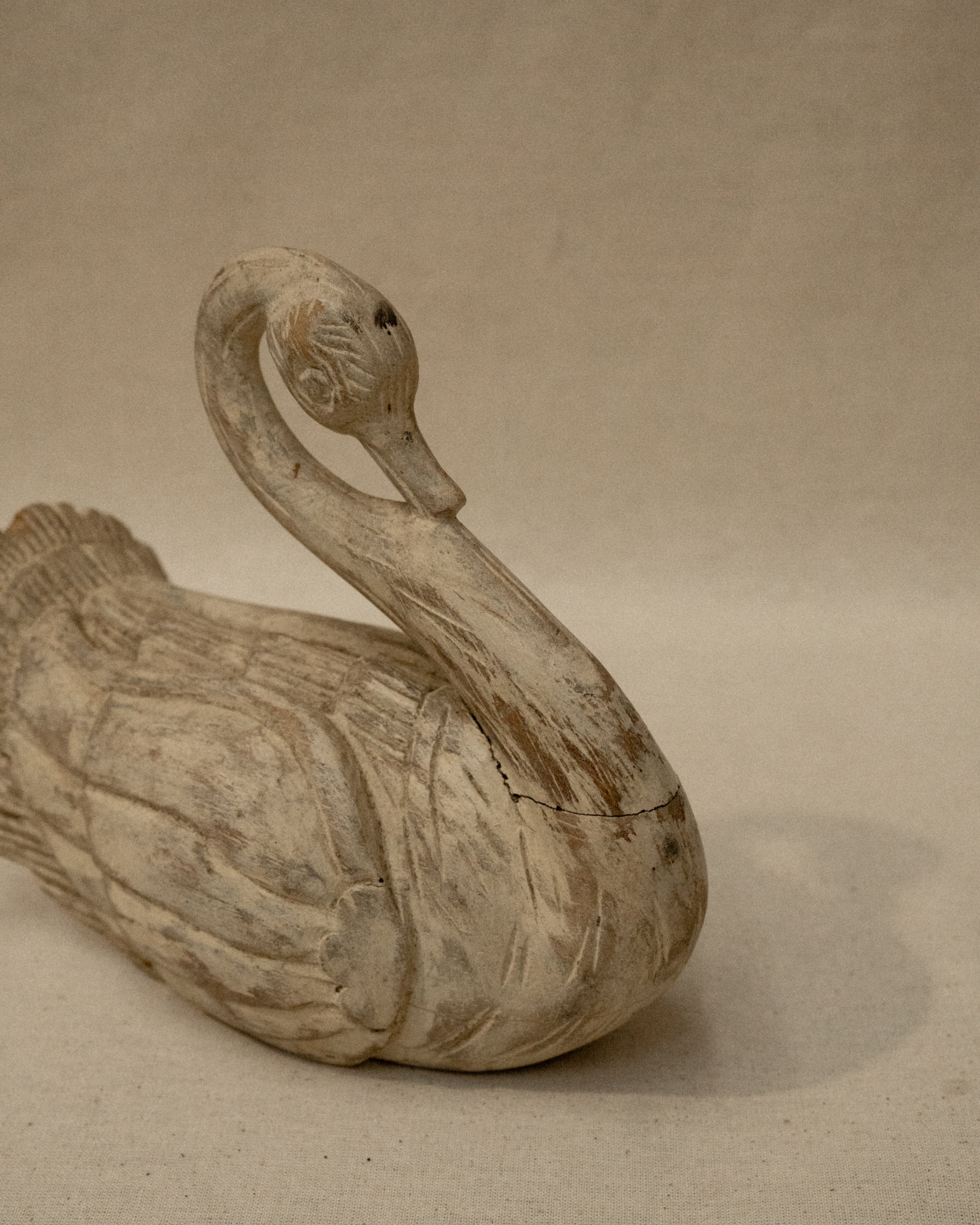 White wooden folk art swan