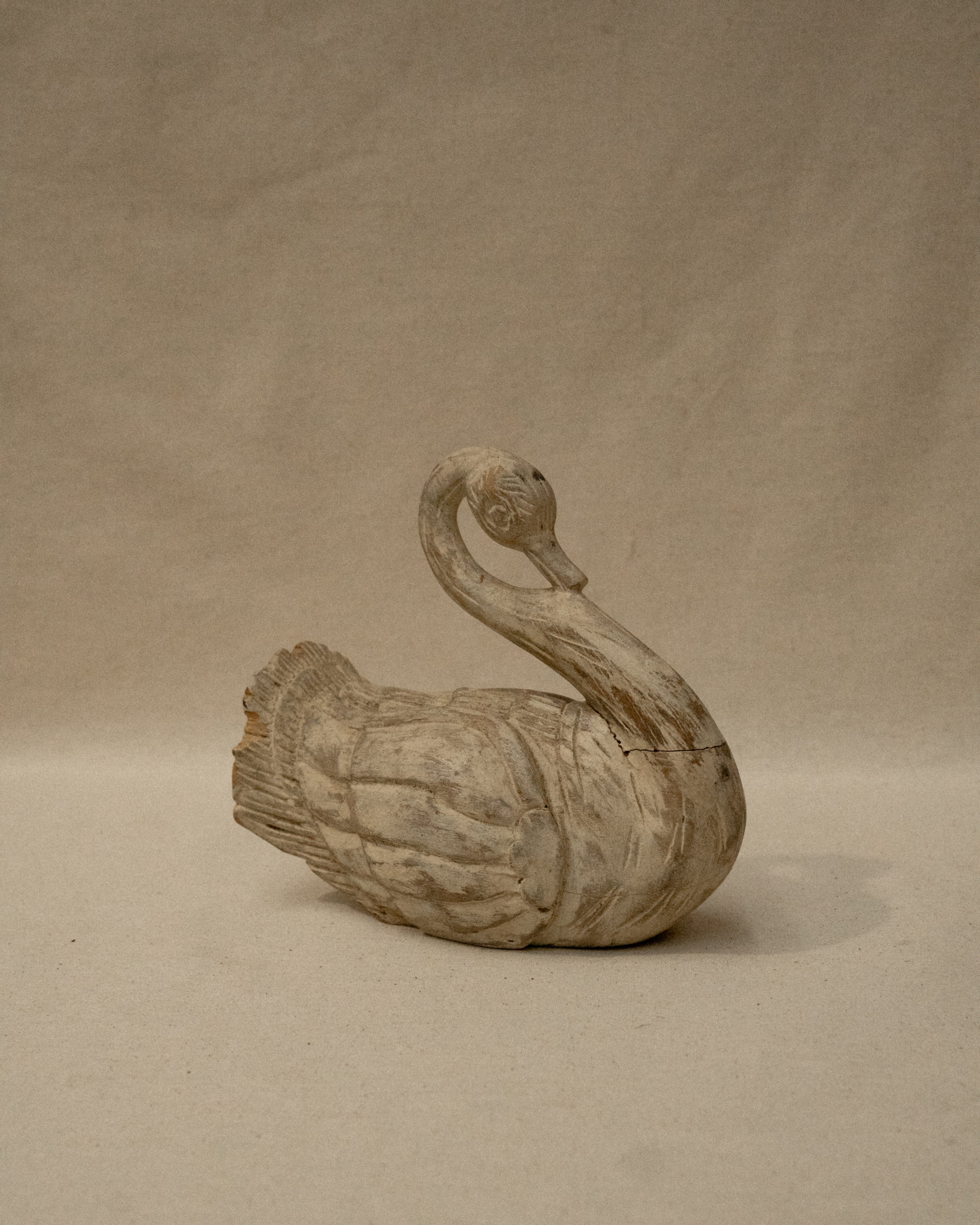 White wooden folk art swan