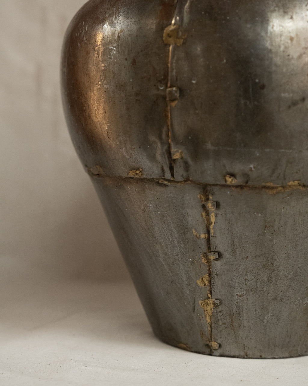 Indian water vessel with silvery tone and brass solder