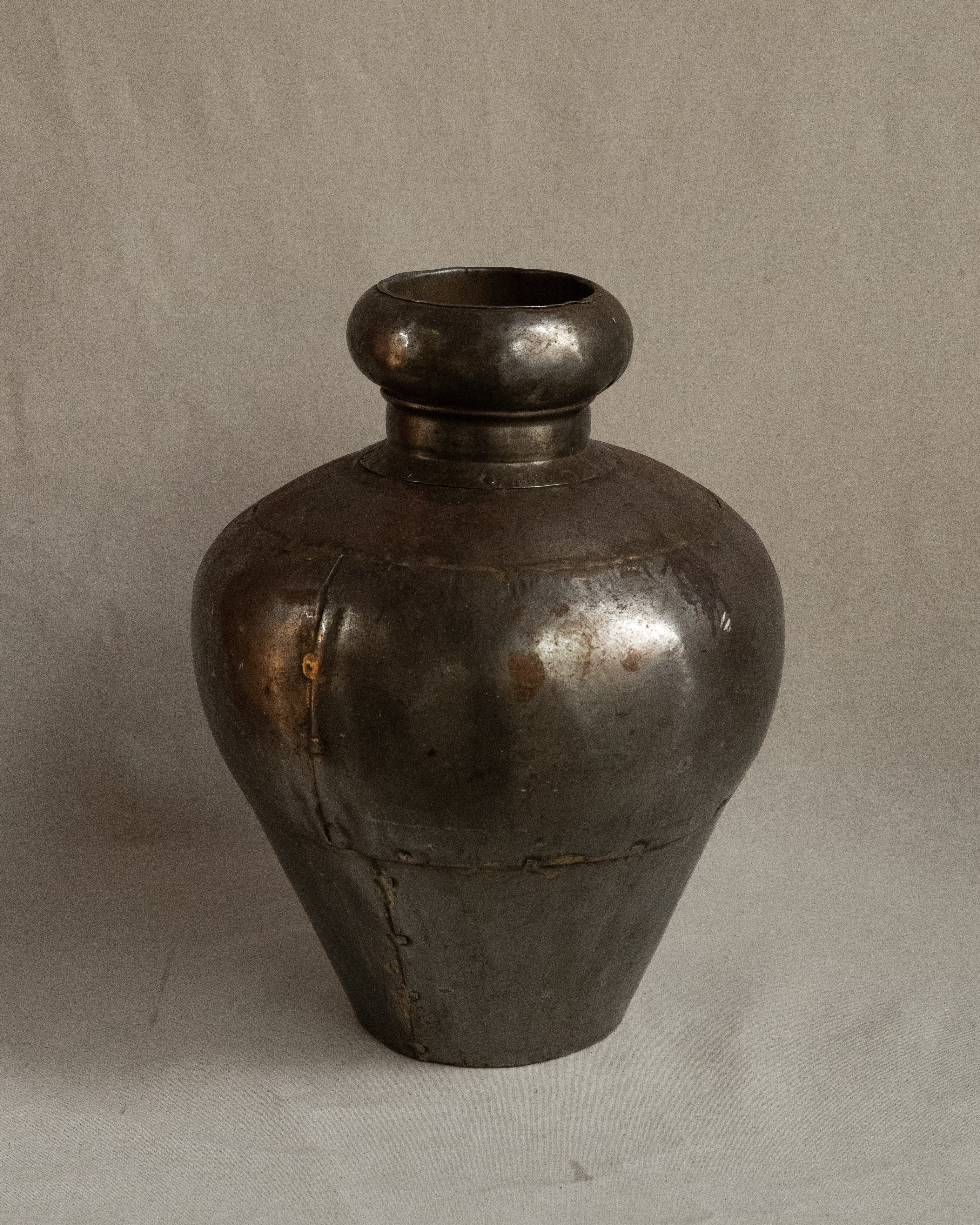 Indian water vessel with silvery tone and brass solder