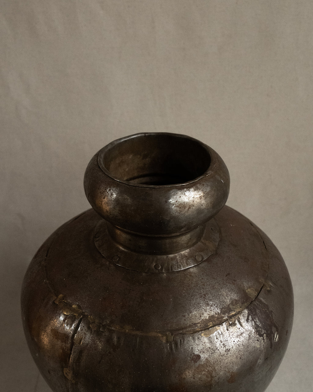 Indian water vessel with silvery tone and brass solder