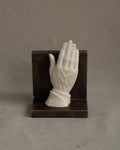 Ceramic taupe bookend with white hand, signed 1985