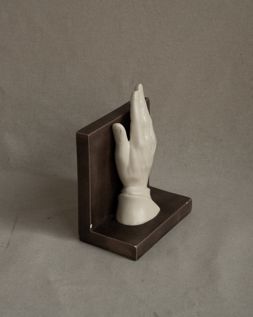 Ceramic taupe bookend with white hand, signed 1985