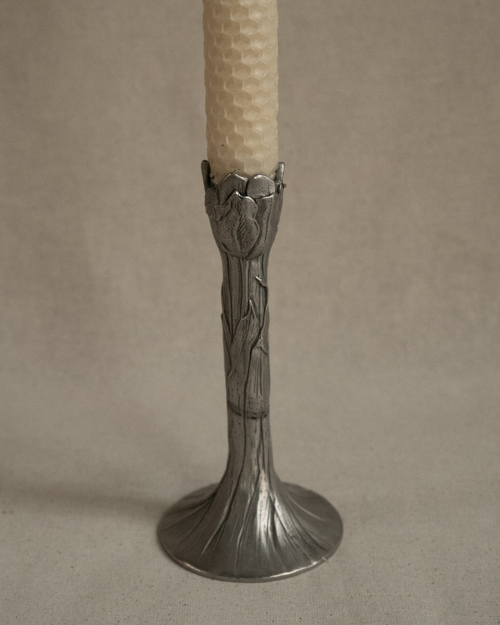 Pair of tulip pewter candle holders