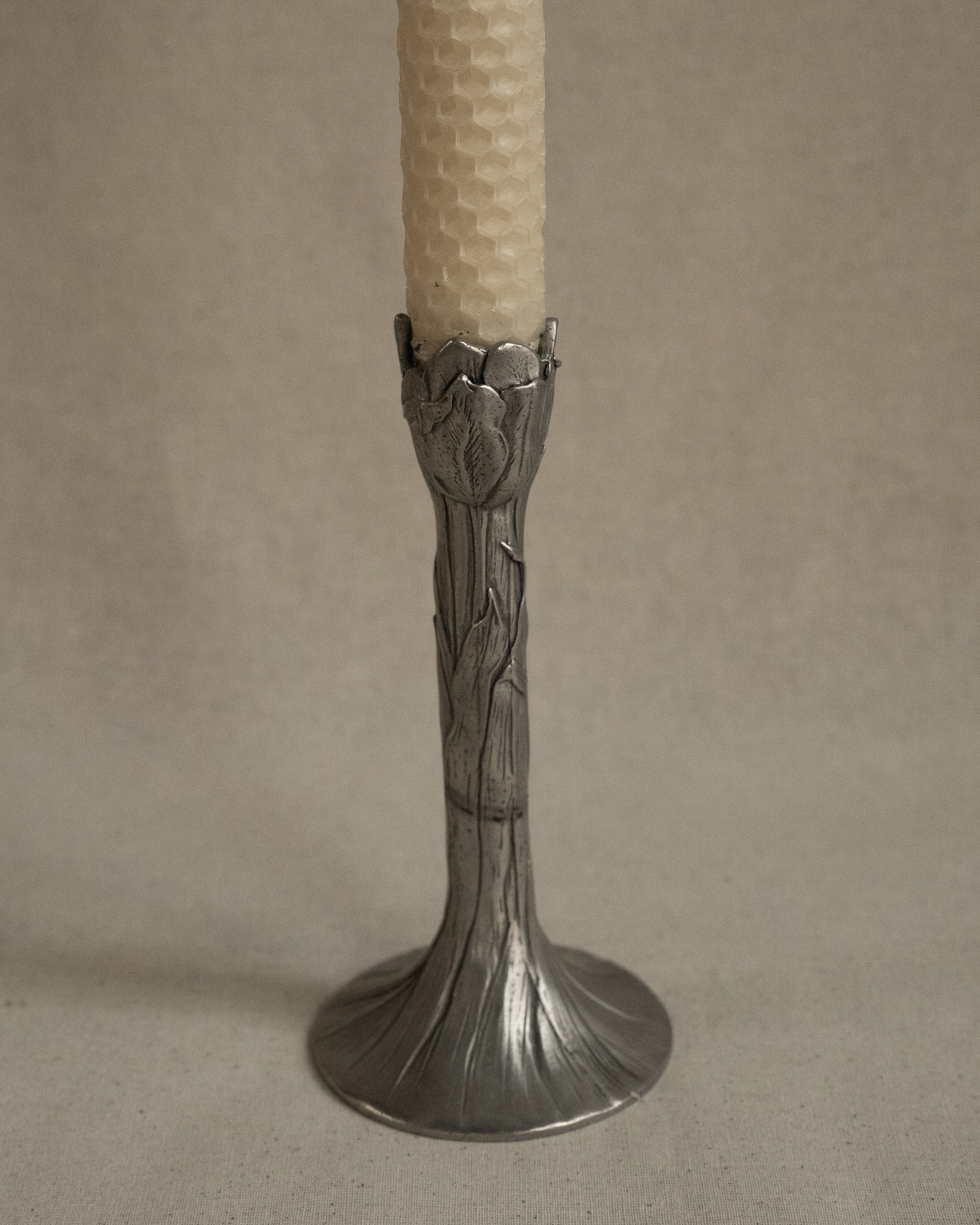 Pair of tulip pewter candle holders