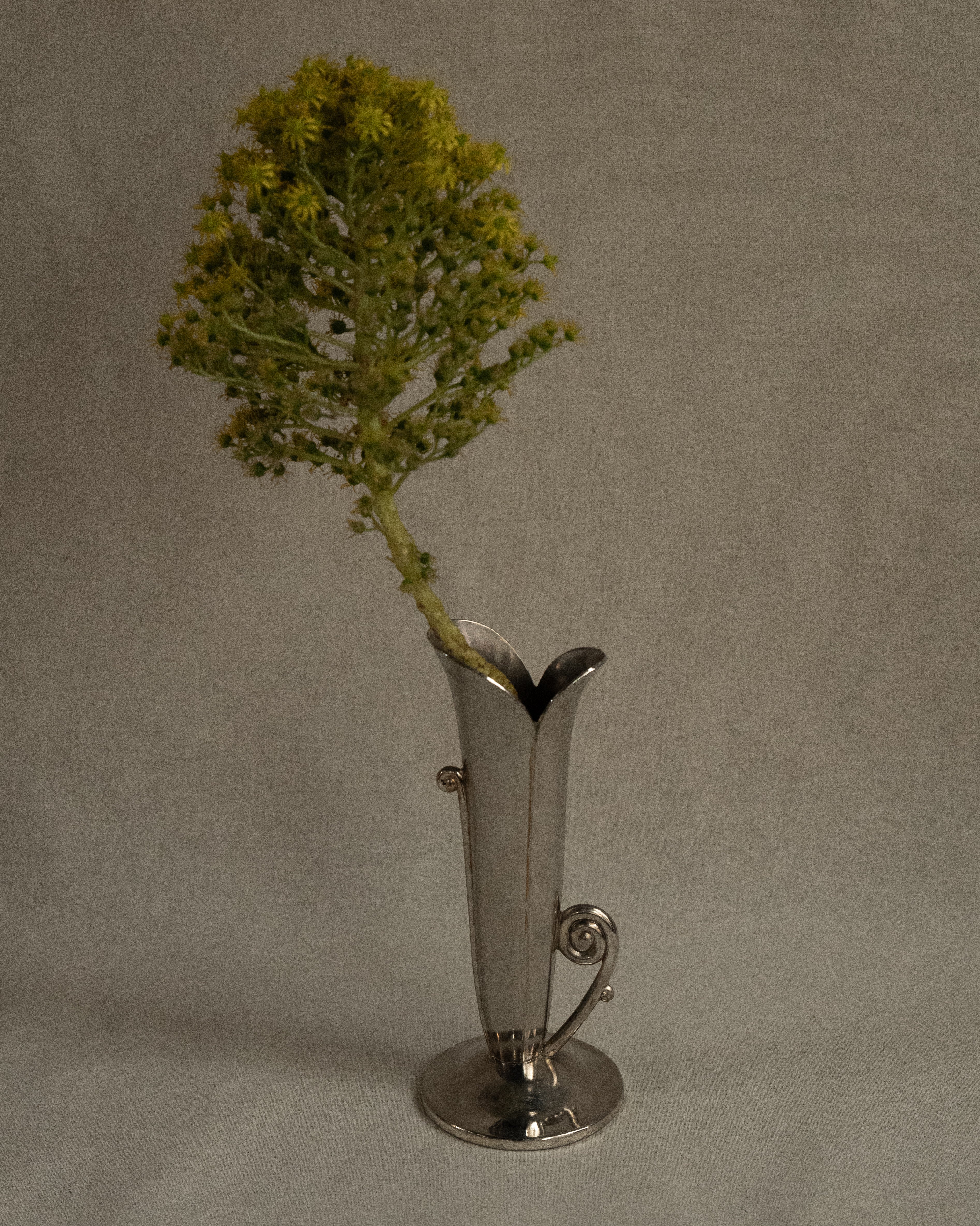Silver plated flower shaped vase with spiral handles