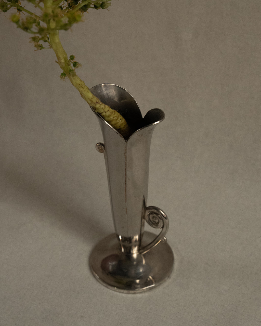 Silver plated flower shaped vase with spiral handles