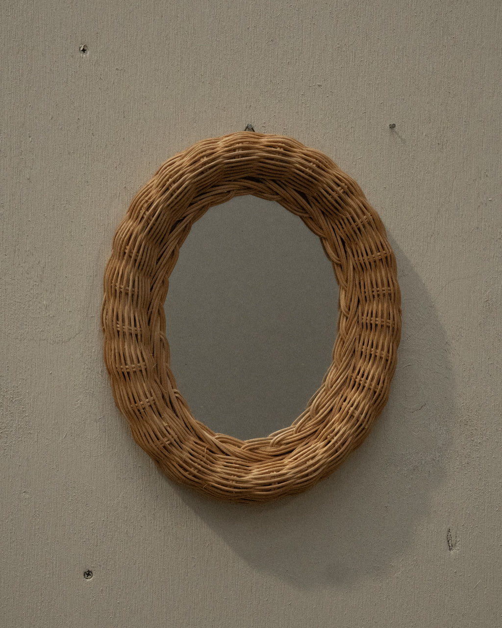 Woven rattan wall mirror