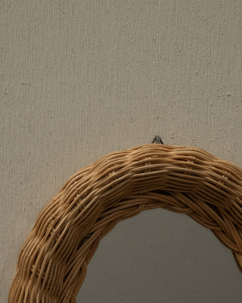Woven rattan wall mirror