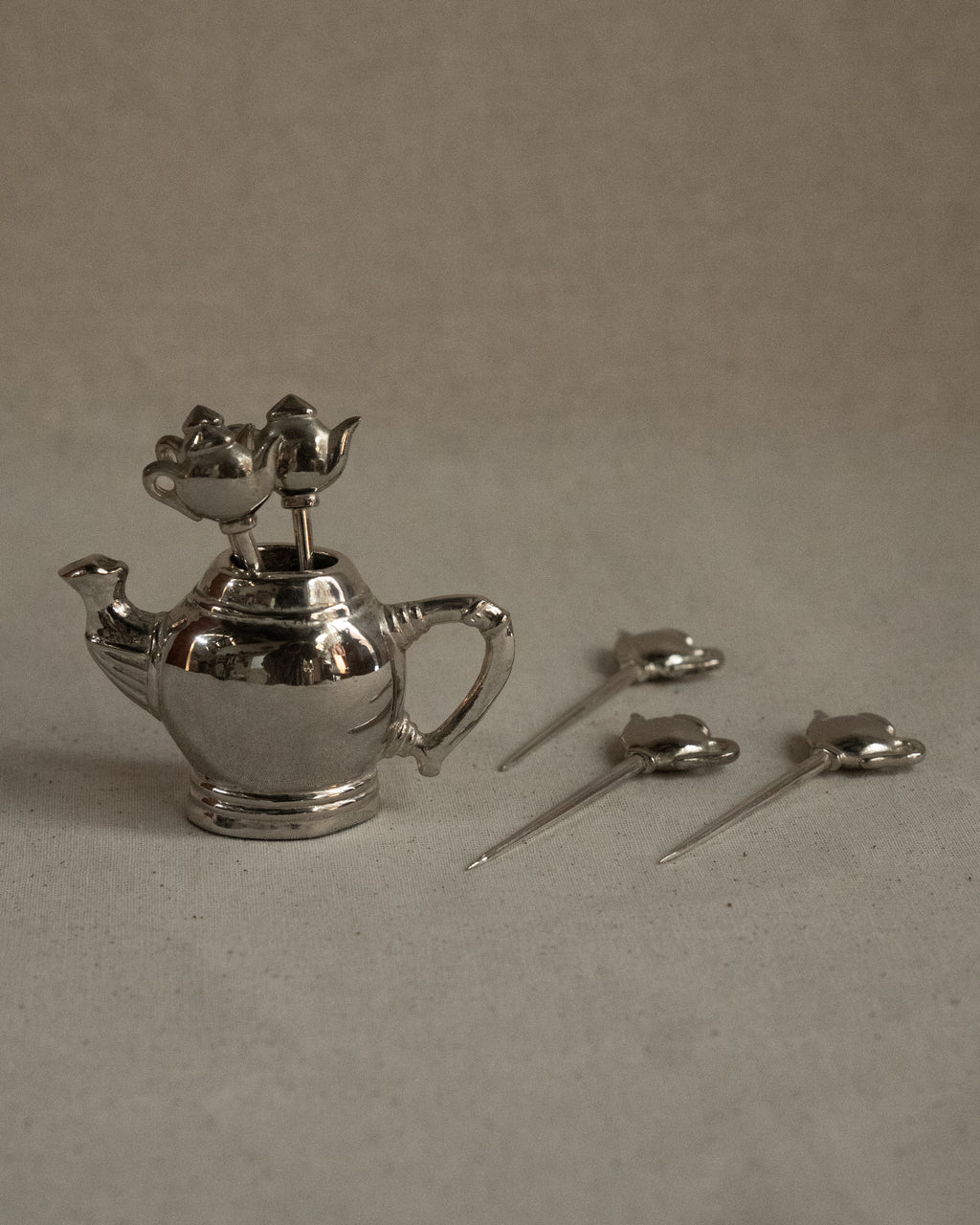 Chrome teapot with toothpicks