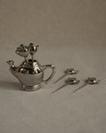 Chrome teapot with toothpicks