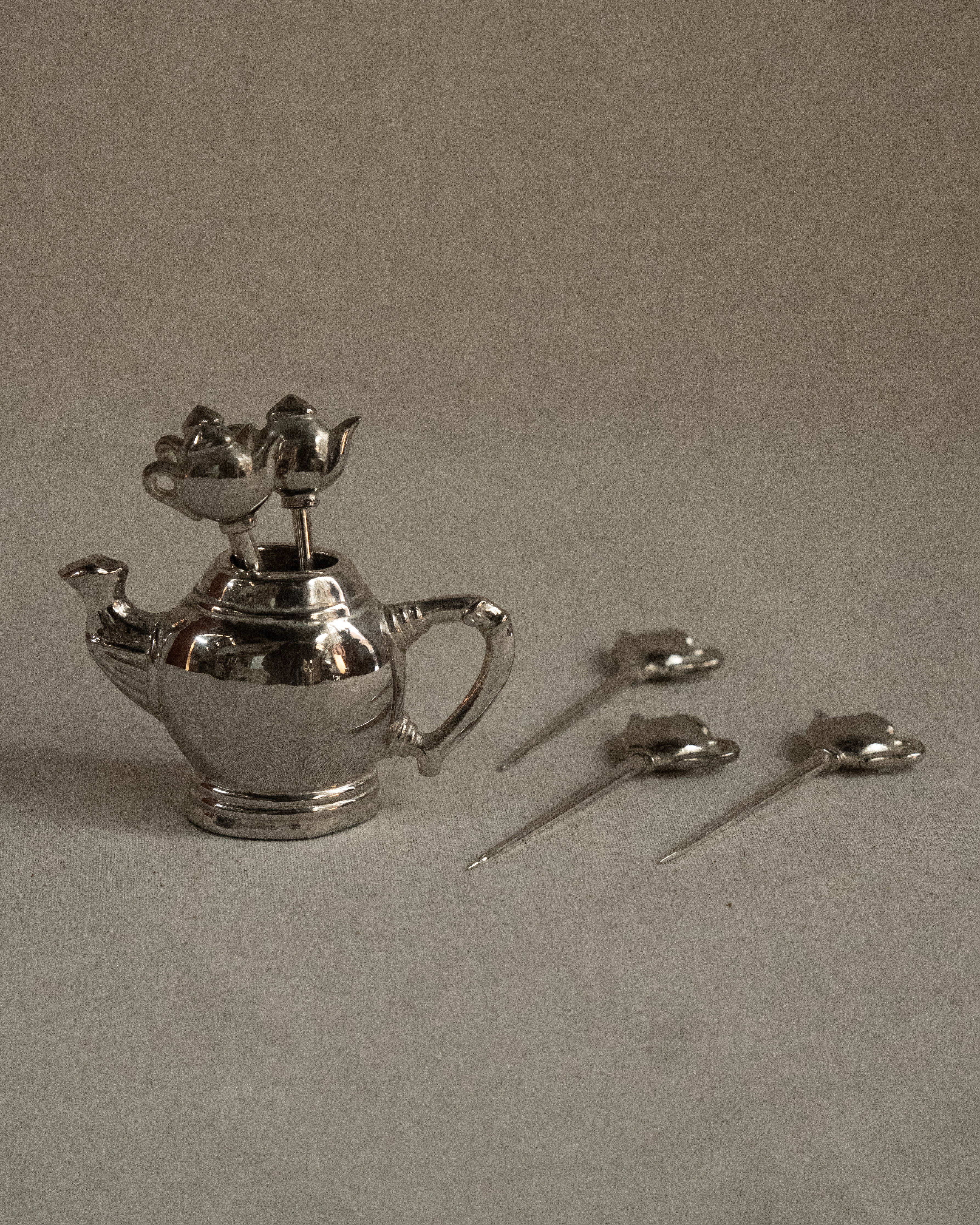 Chrome teapot with toothpicks