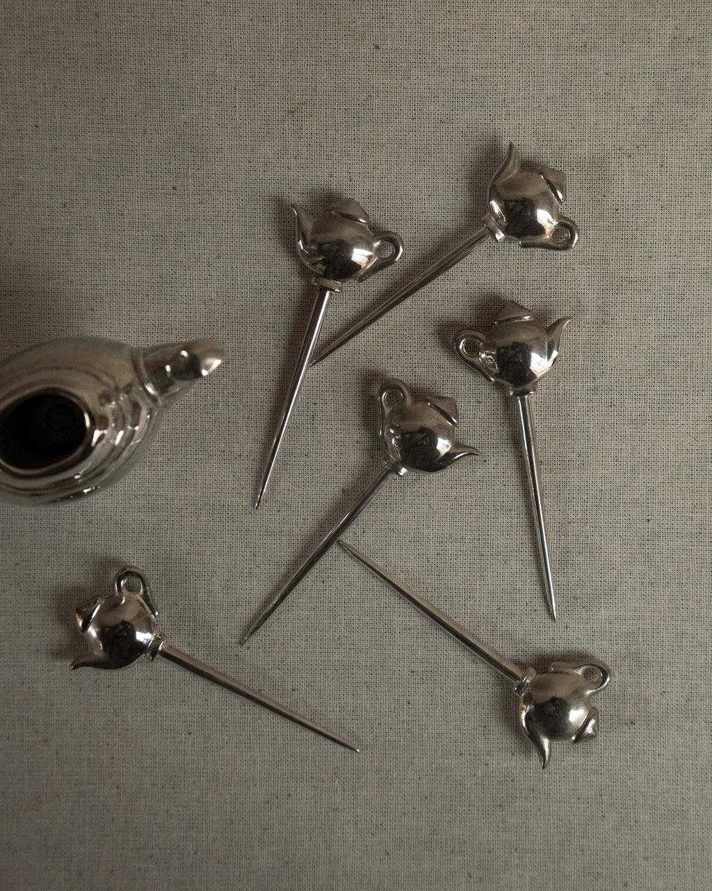 Chrome teapot with toothpicks