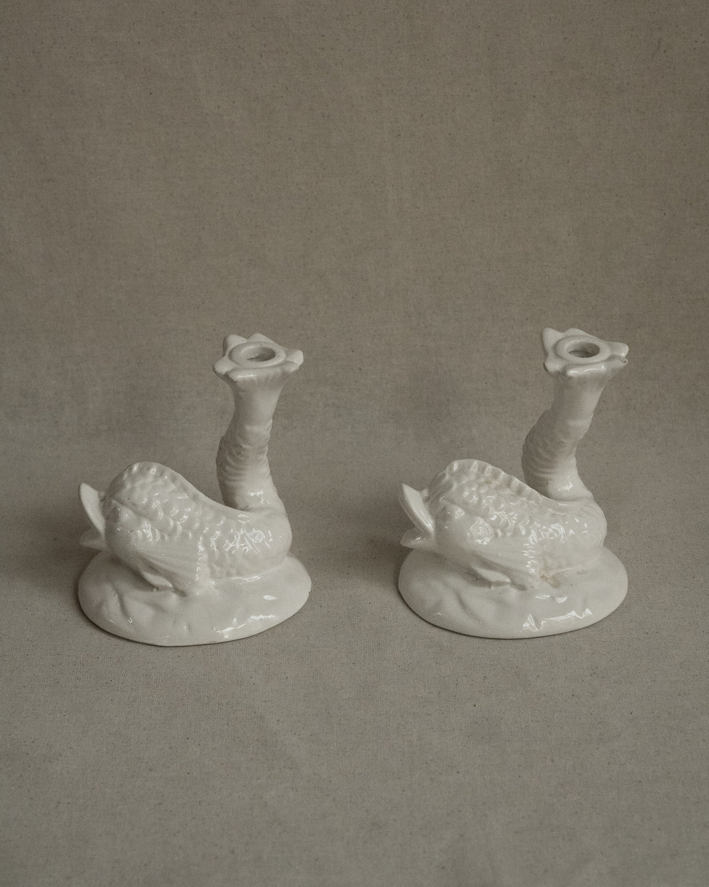 Pair of white ceramic fish candle holders