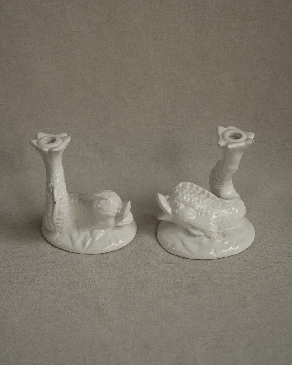 Pair of white ceramic fish candle holders