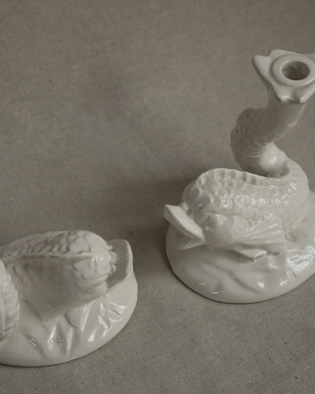 Pair of white ceramic fish candle holders