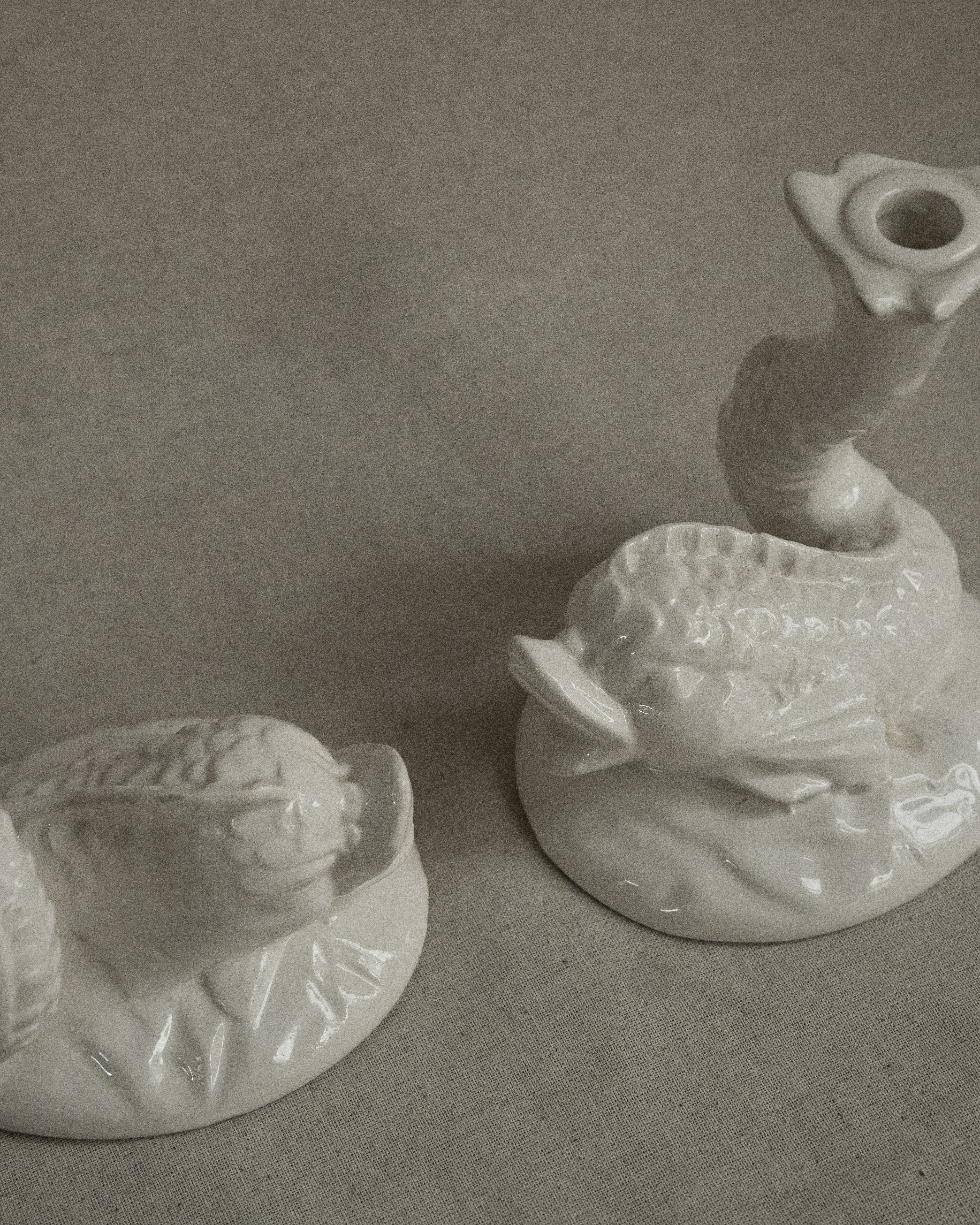 Pair of white ceramic fish candle holders