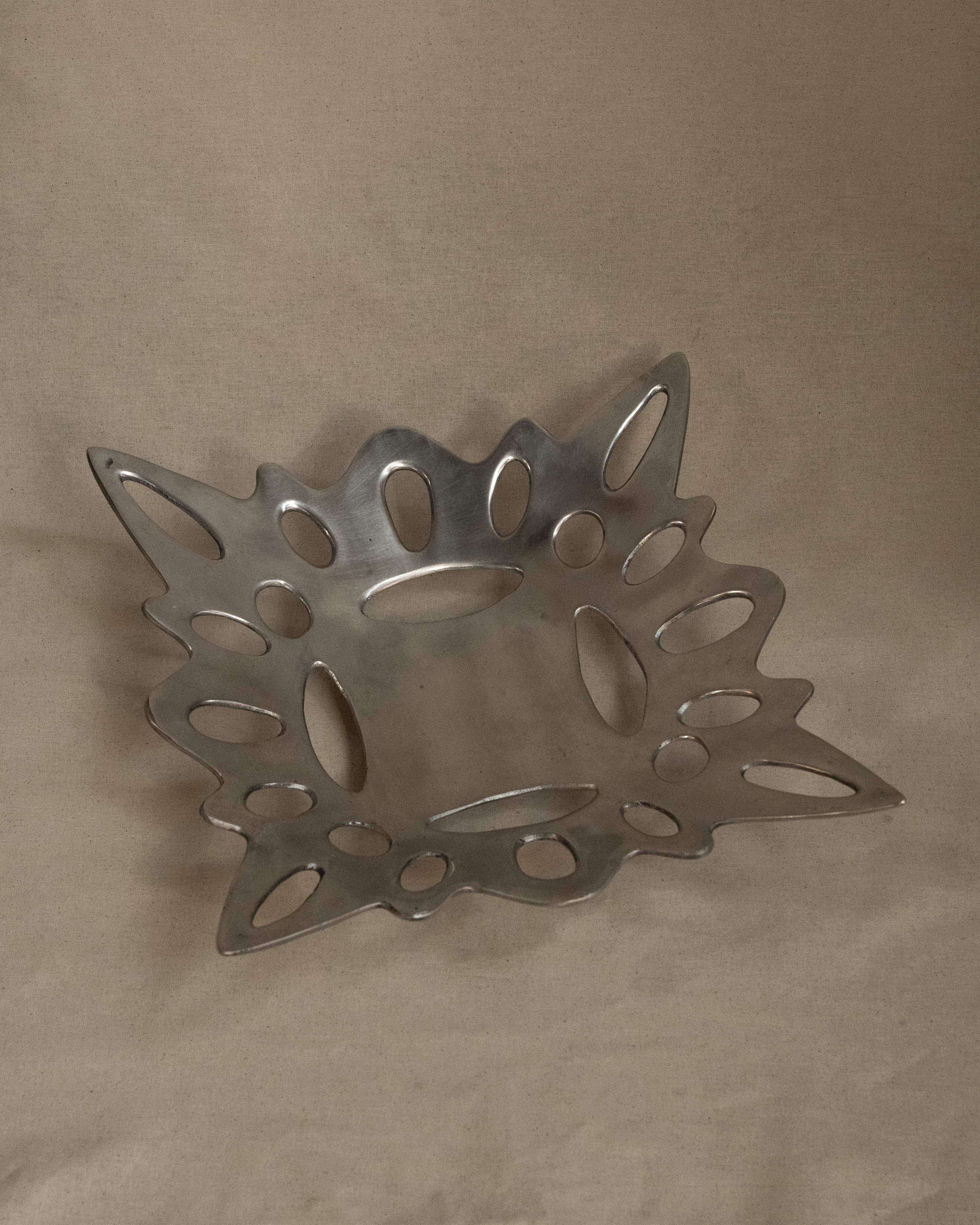 Aluminum abstract dish with tapered feet