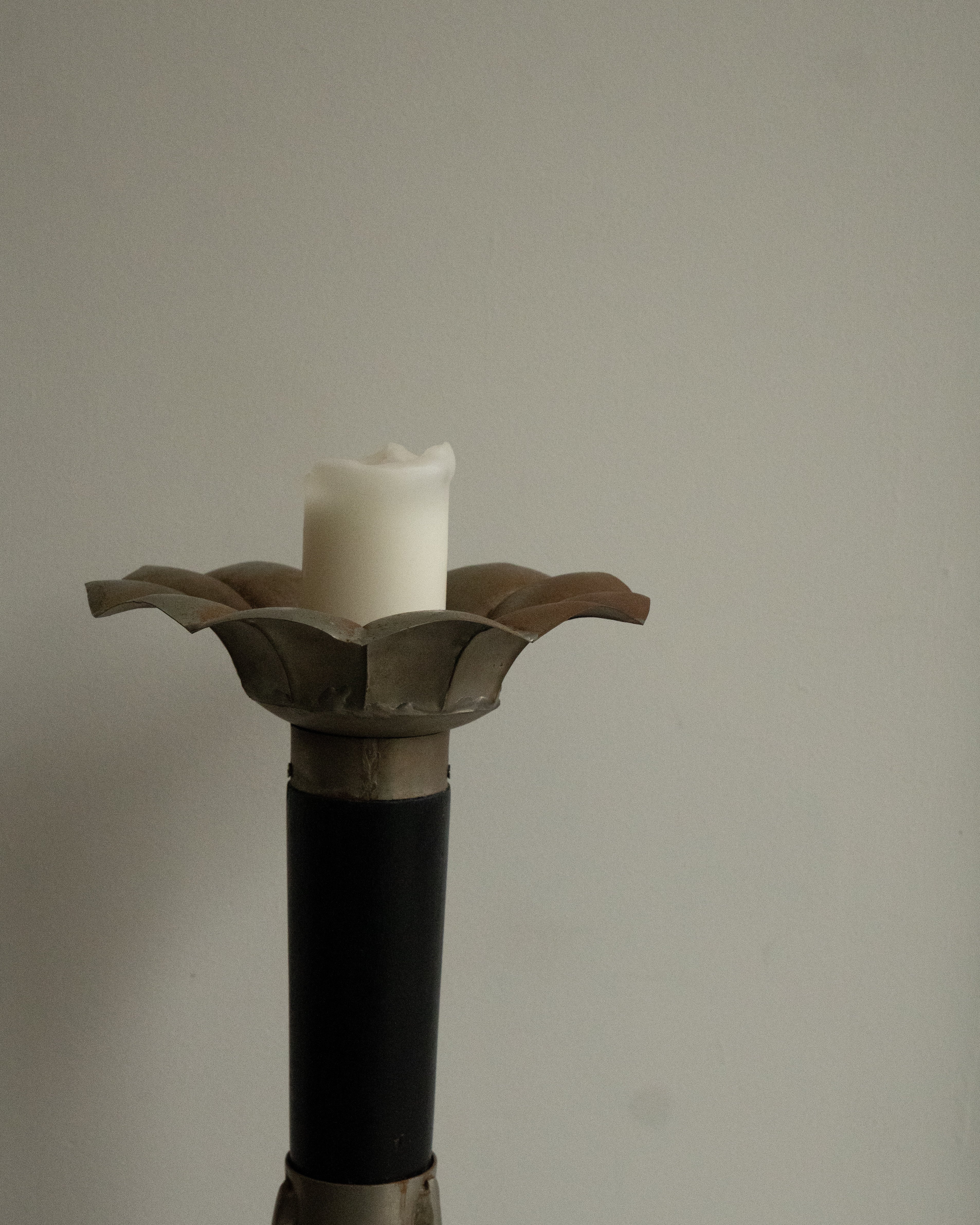 Sculptural pillar candle holder