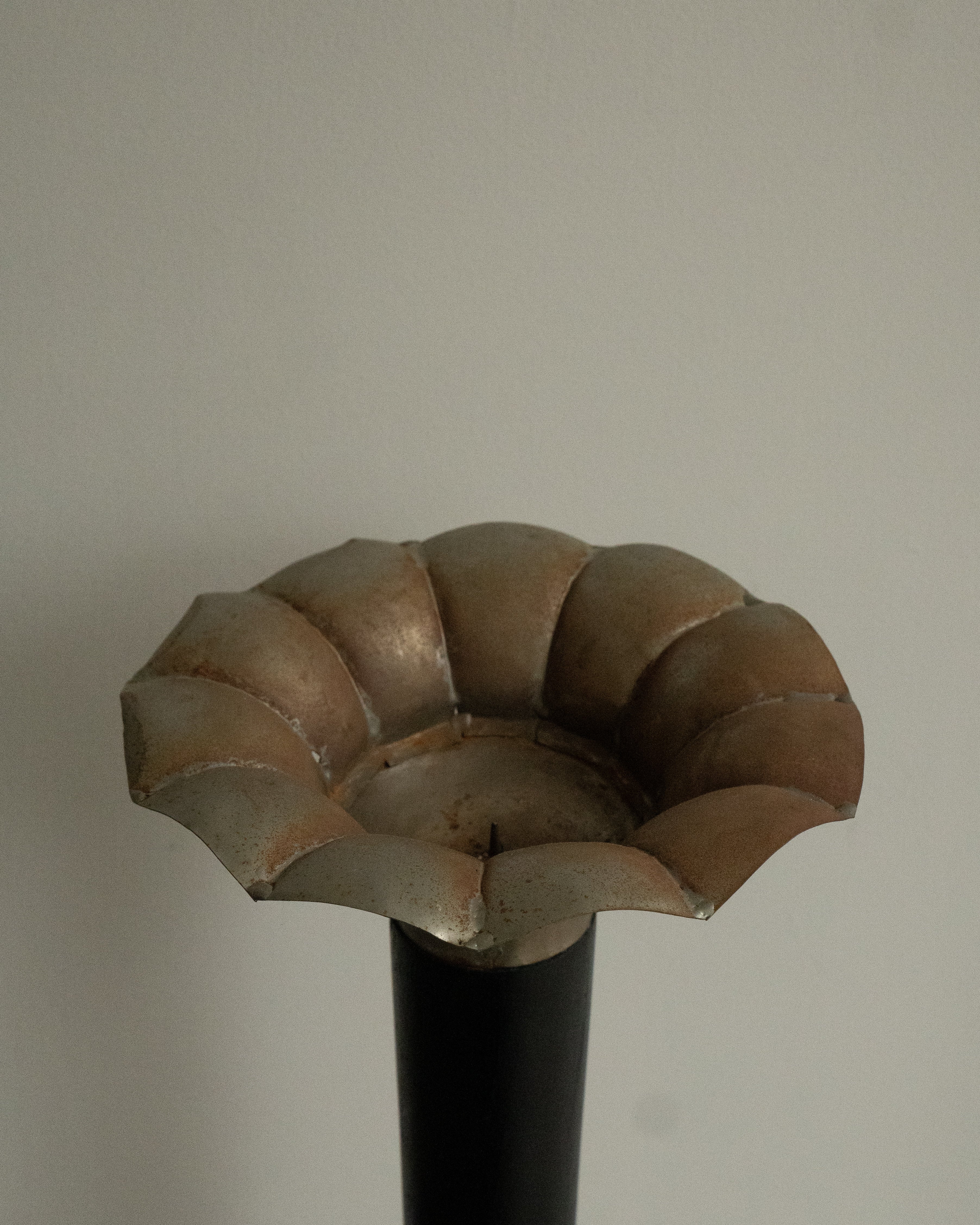 Sculptural pillar candle holder