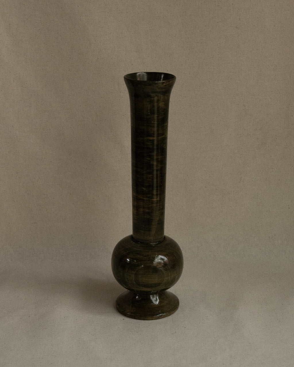 Green stained wooden vessel