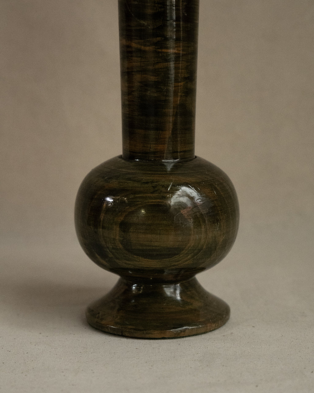 Green stained wooden vessel