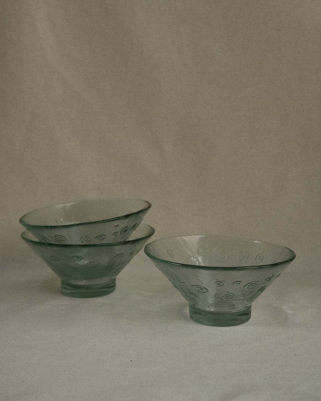 Tinted green glass bowl with spirals