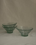 Tinted green glass bowl with spirals