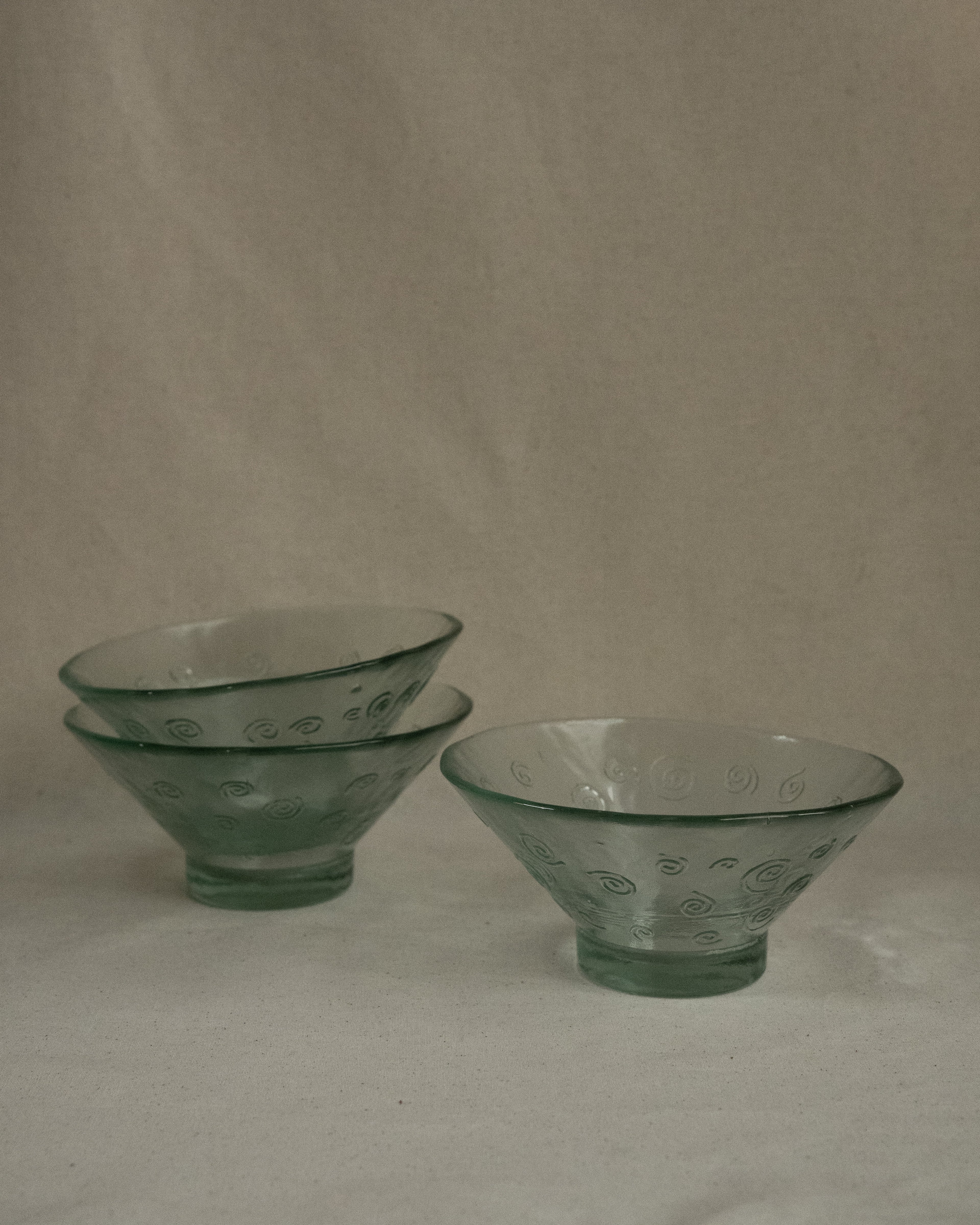 Tinted green glass bowl with spirals