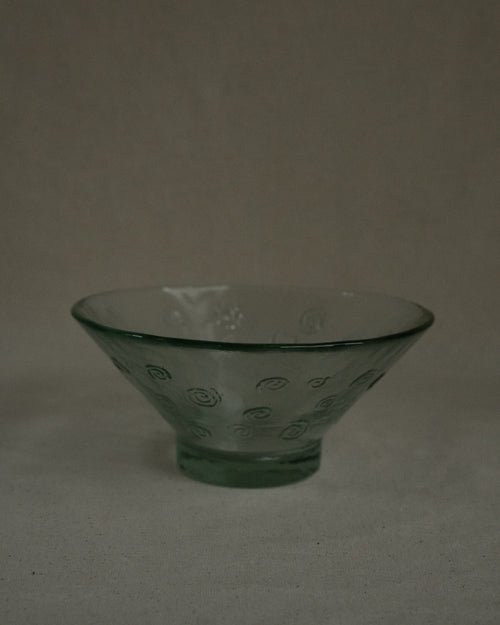 Tinted green glass bowl with spirals