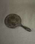 Silver plated ornate handheld mirror