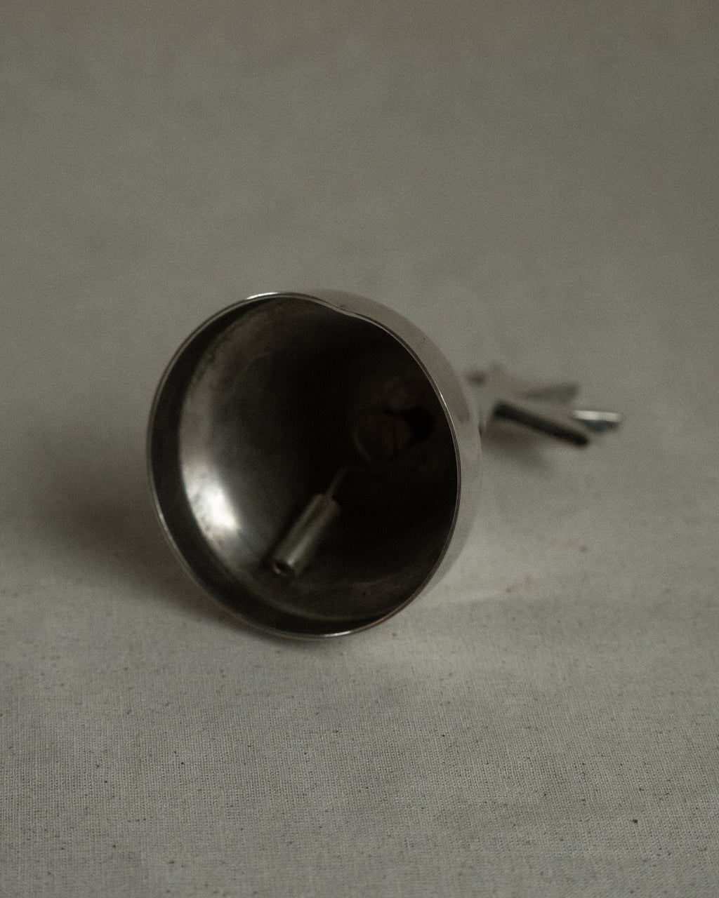 Silver plated bell with cross
