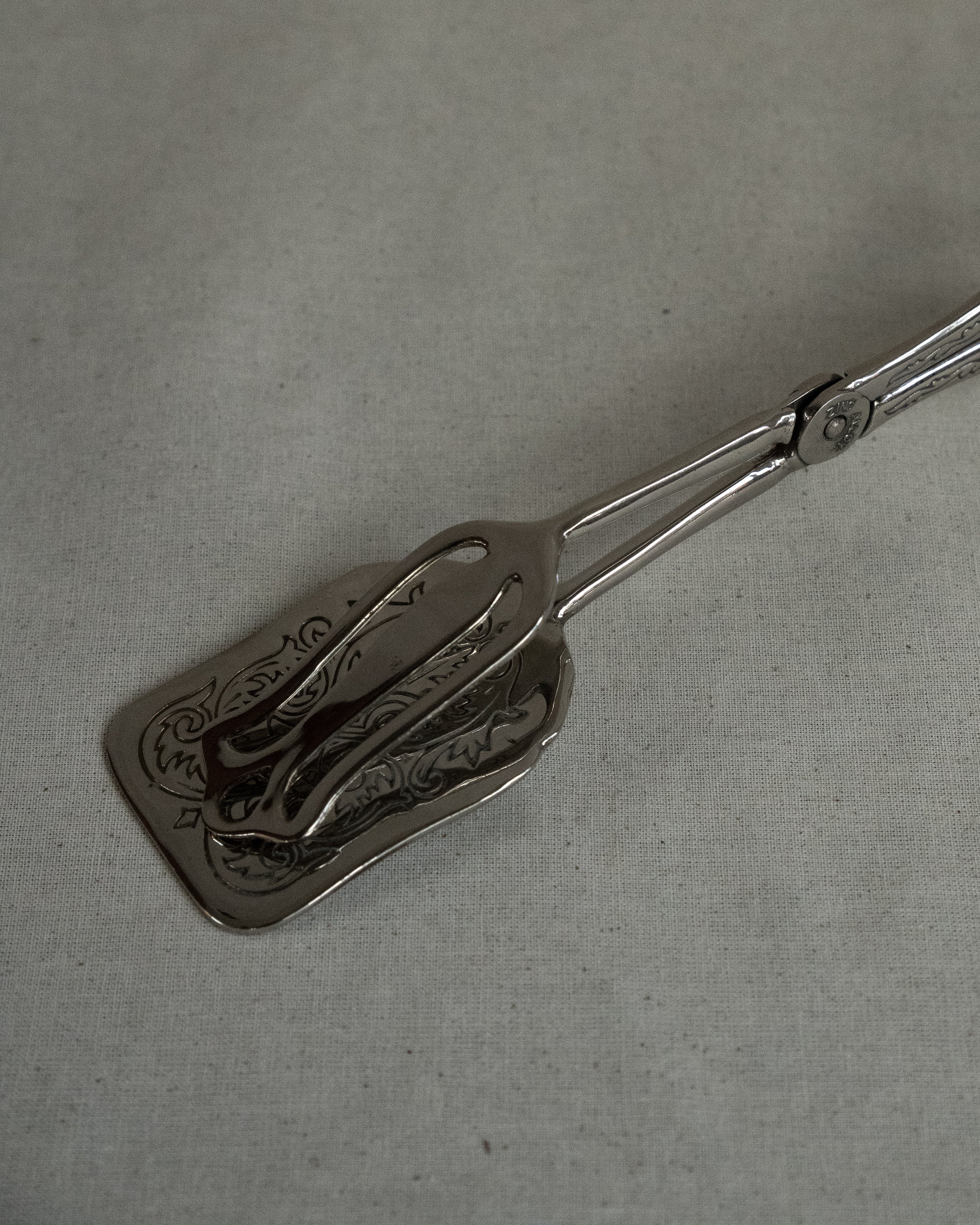 Silver plated tongs
