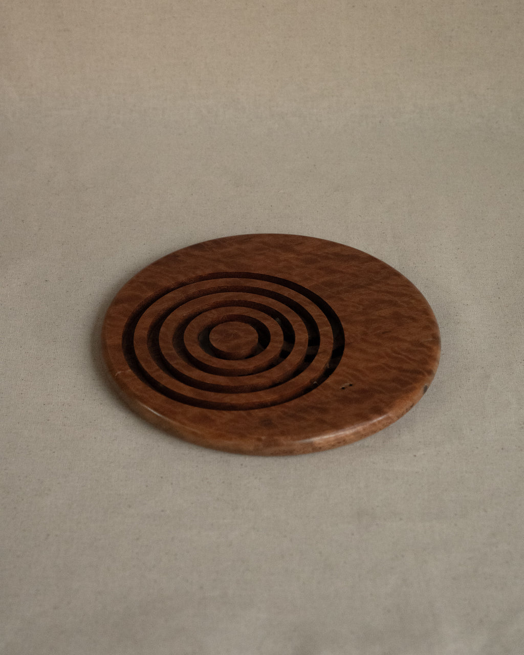 Wooden trivet with circle cut outs