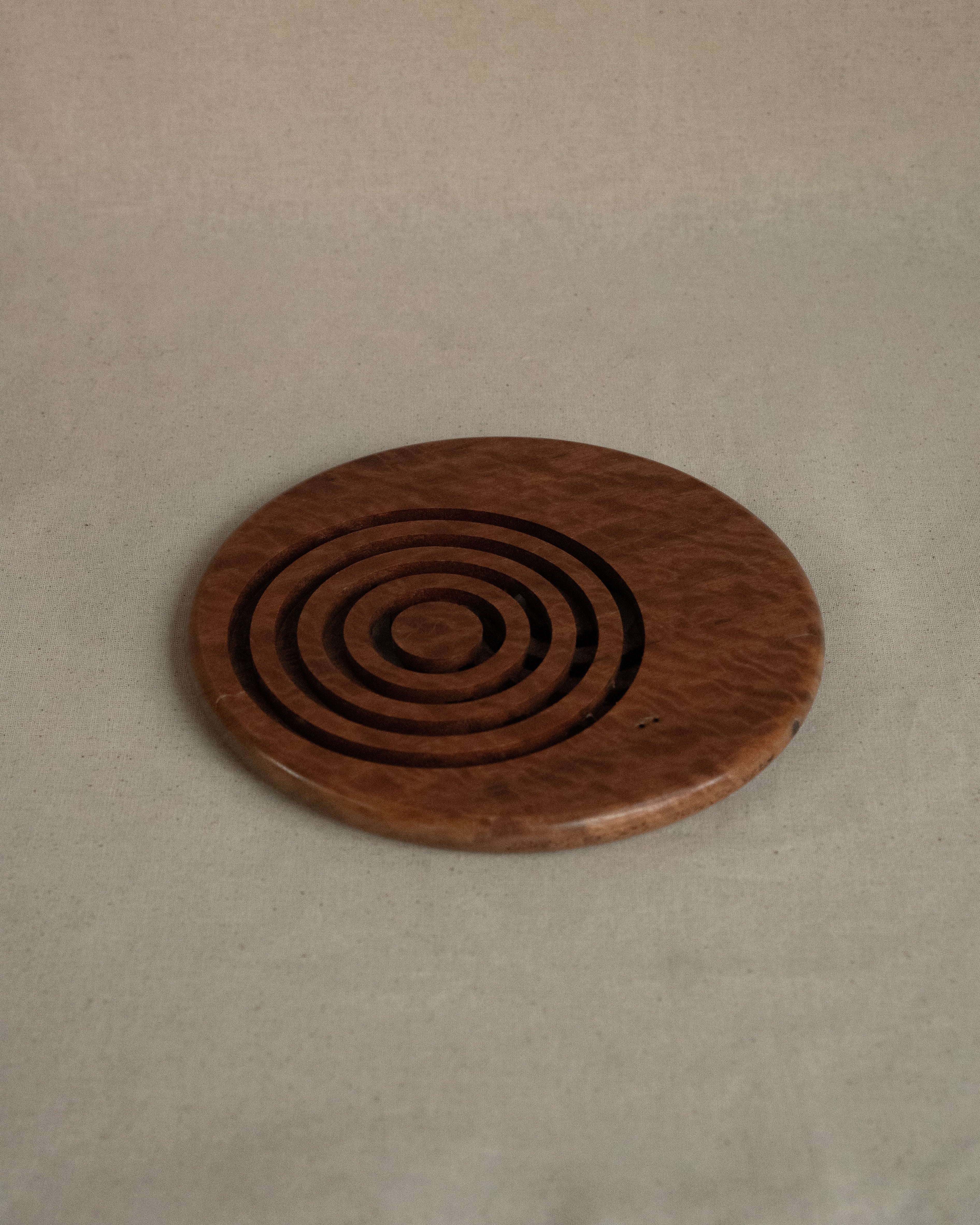 Wooden trivet with circle cut outs