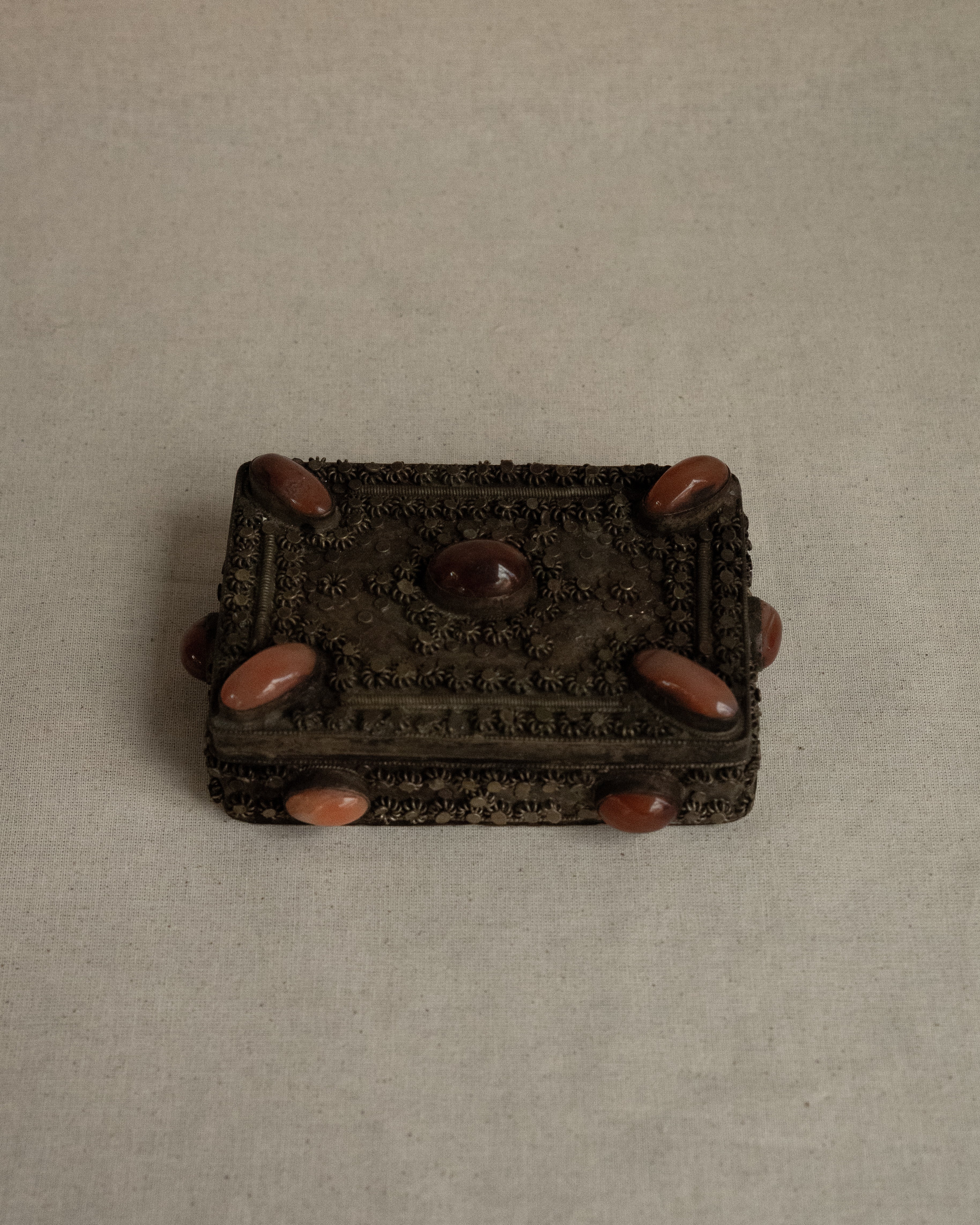 Tibetan filigree box with potentially carnelian gems