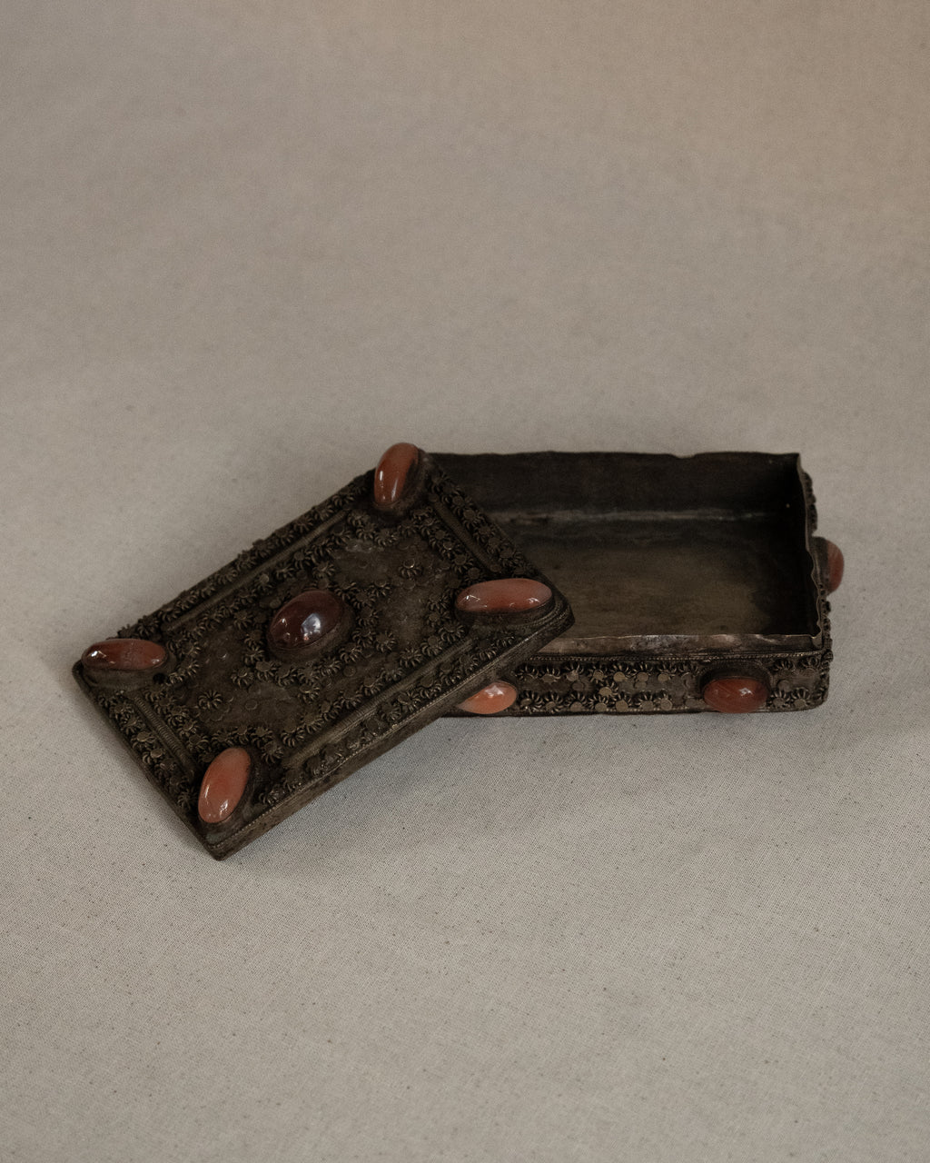 Tibetan filigree box with potentially carnelian gems