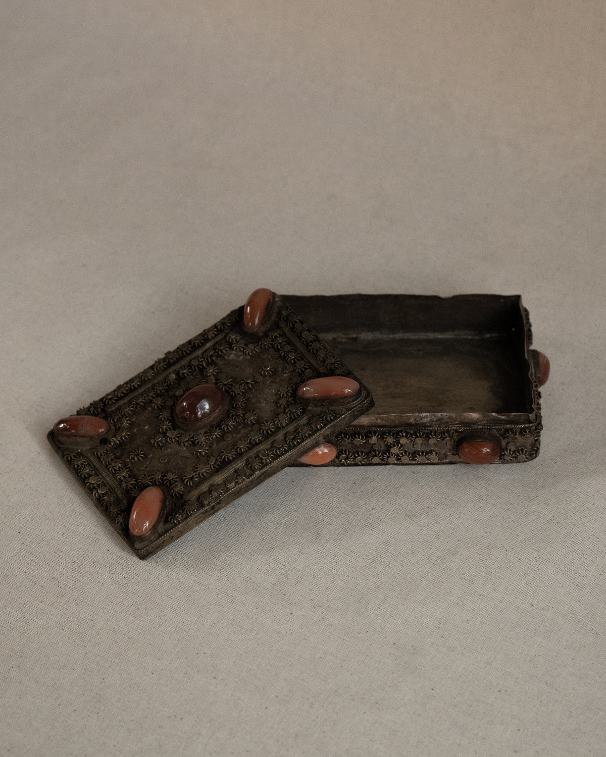 Tibetan filigree box with potentially carnelian gems