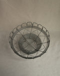 Metal wire basket with triangle, spiral and square scalloped details