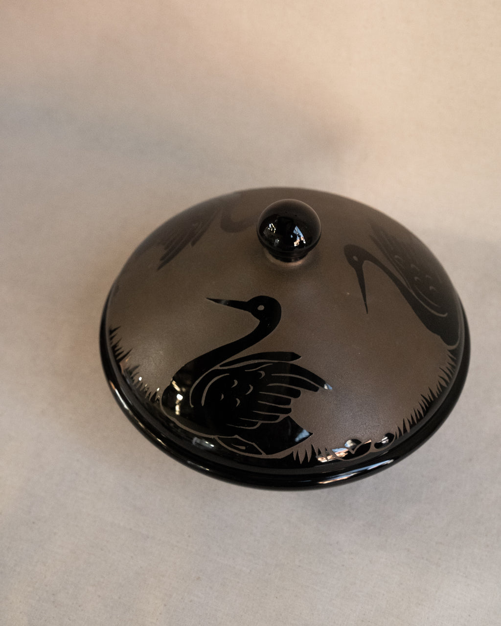 Etched black glass covered bowl with three swans in art nouveau style