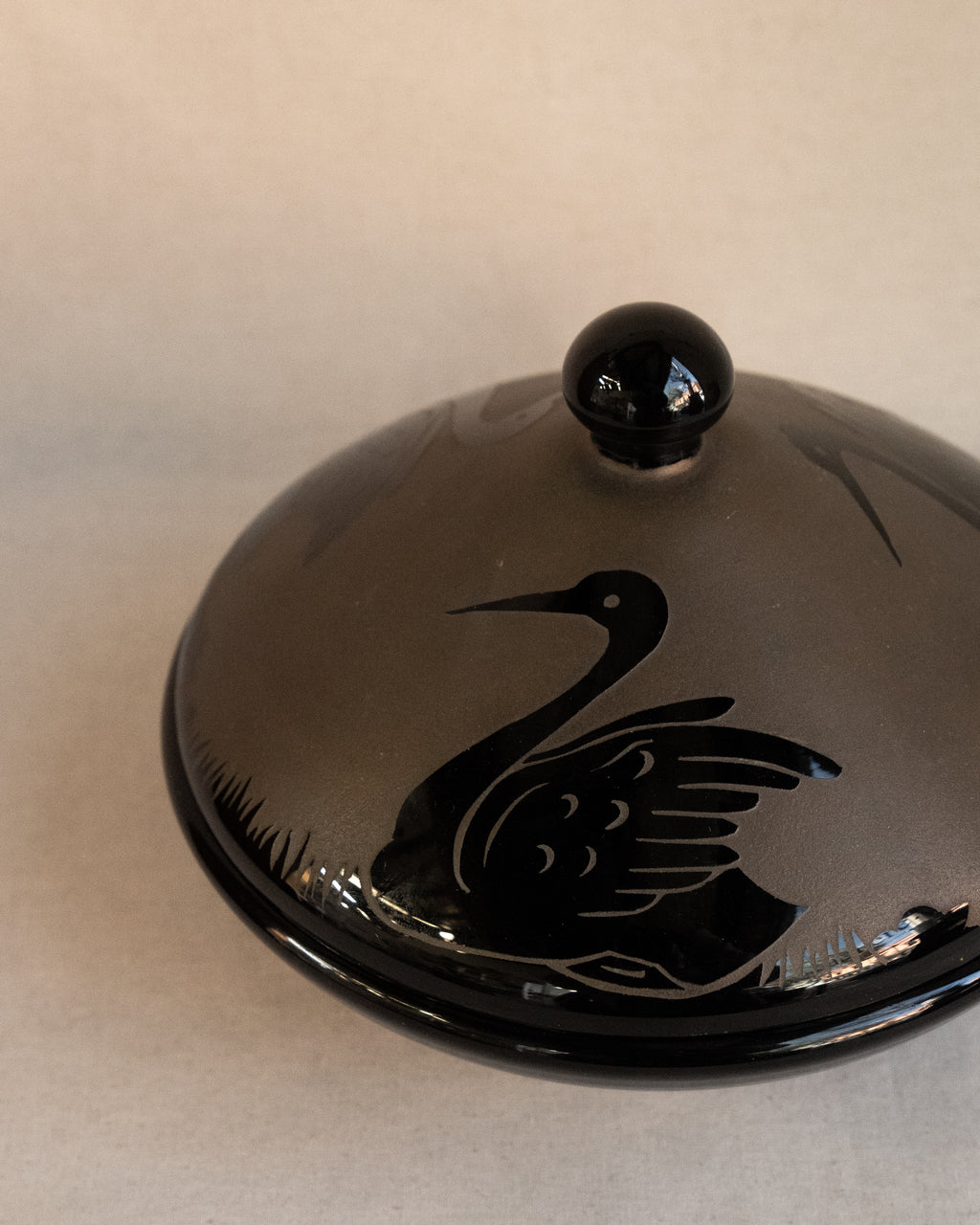 Etched black glass covered bowl with three swans in art nouveau style