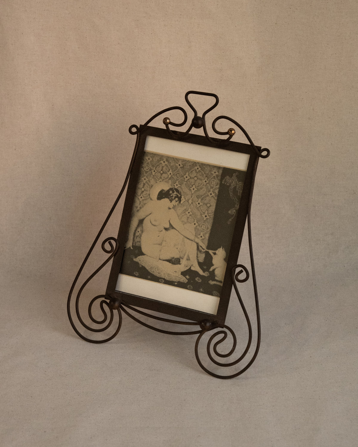 Art nouveau style picture frame with Norman Lindsay photo