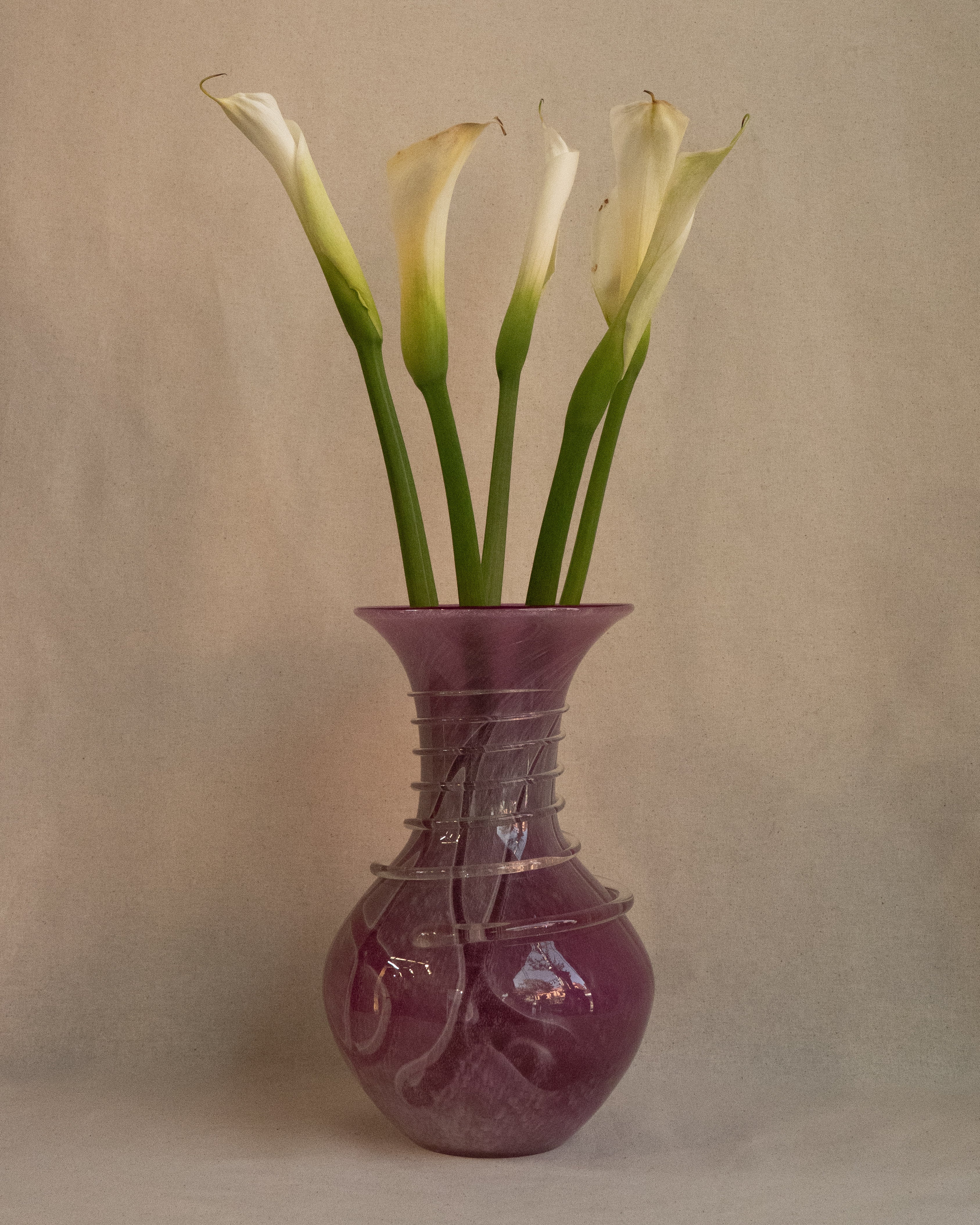 Pink art glass vase with external trailing
