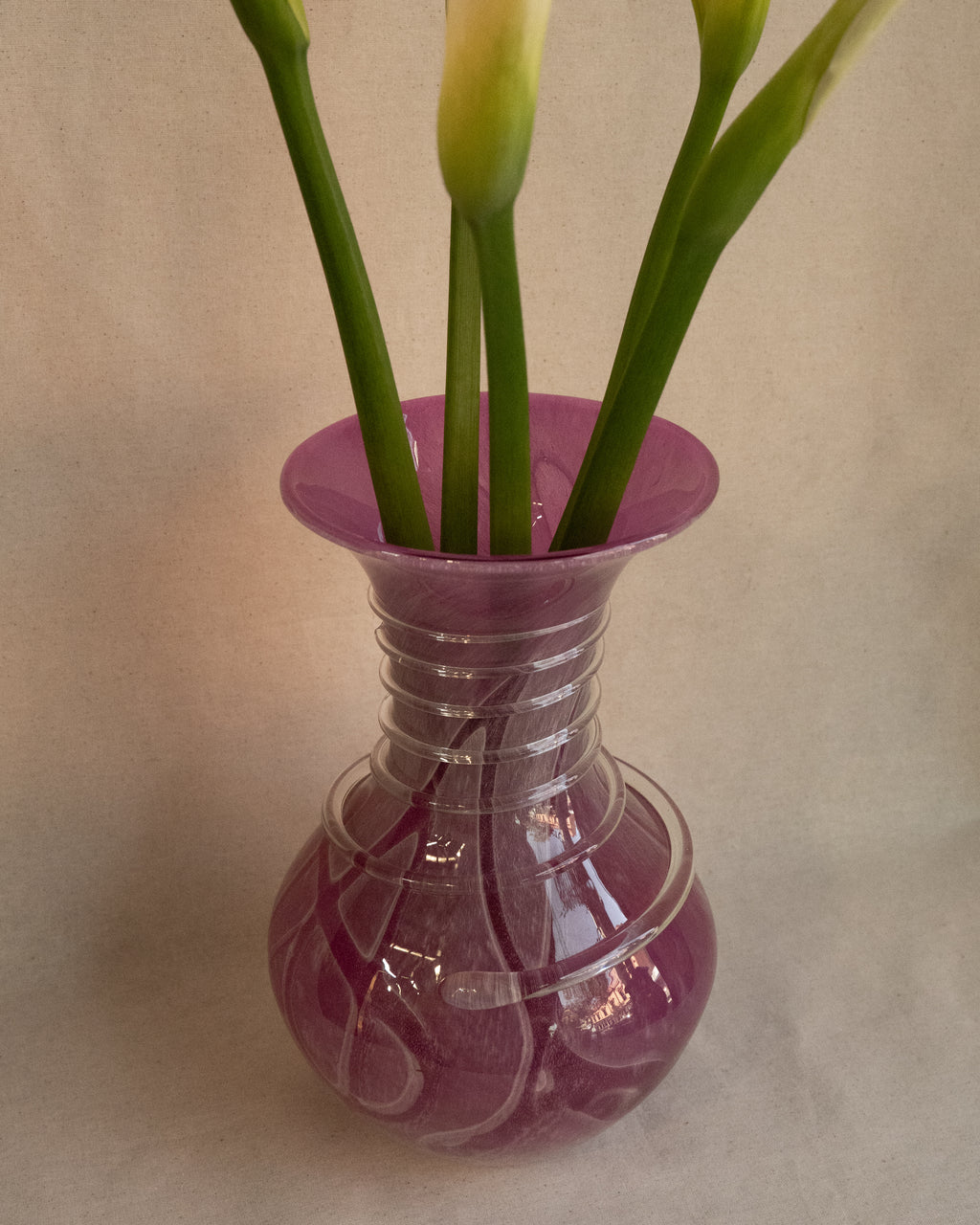 Pink art glass vase with external trailing
